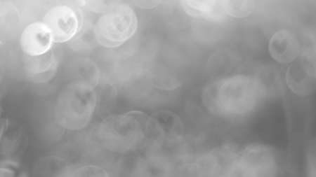 Black and white images, bokeh backgrounds made from heart-shaped blurred lenses, express love.の写真素材