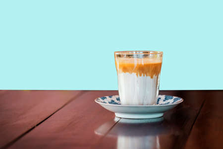 Milk coffee on the wooden table in the morning with clipping path easy to use