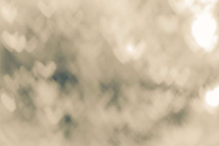 Abstract background of heart-shaped bokeh created by blurred lens. Use it as a background in any...