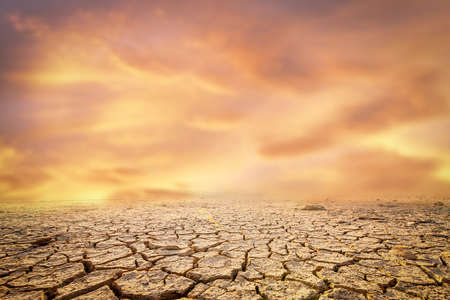 The picture shows the effect of drought, cracked soil, no seasonal rain. Because caused by global warming. global warming conceptの写真素材