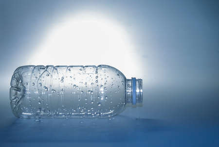 Clear plastic water bottle on a white background. plastic waste water bottle on white backgroundの写真素材