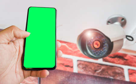 cctv and mobile with green blank screen or copy space to put the desired content in your project....