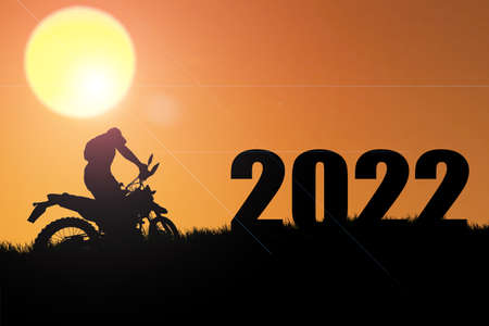 Concept Happy new year 2022 Silhouette image of happy man from 2021 up to 2022 on beautiful skyの写真素材