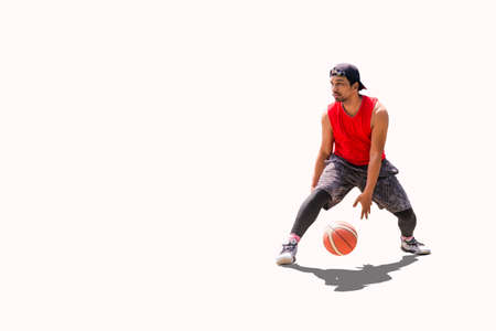 Asian basketball player practicing dribbling on colored background wiht clipping pahtの写真素材