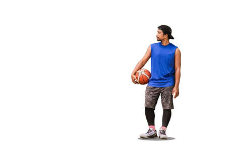 Southeast Asian basketball players stand holding a basketball on a concrete wall with space to...