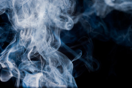 smoke moving background abstract pattern background on a black backgroundの写真素材