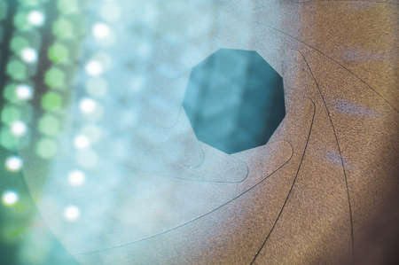 The diaphragm opens and closes the aperture of the camera lens. photography concept