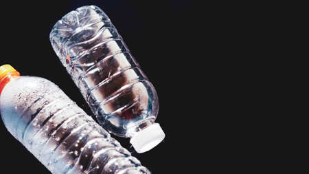 plastic water bottle floating on water on black background Can be easily used in projects. Plastic...