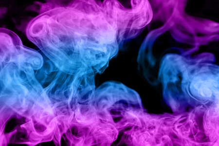 Fluffy Puffs of Smoke and Fog on Black Backgroundの写真素材