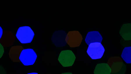 Abstract background of bokeh from a blurred lens on a festive day with green, red, blue, yellow.の写真素材
