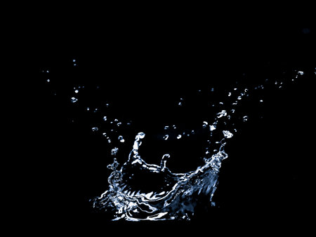 Splashing water on a black background. Water splashes on a black background. diffused water abstractの写真素材