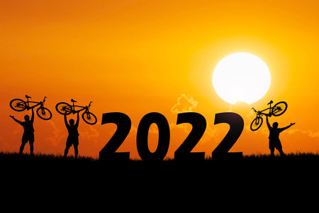 Silhouettes of touring cyclists practicing in the mountains offer beautiful views in the...