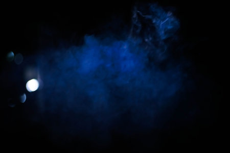 Blurred lens. Blue smoke on a black background. for background use. background image conceptの写真素材