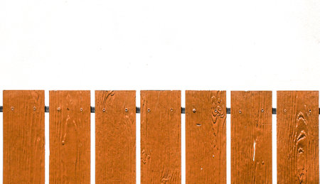 house fence made of wooden slats on a white backgroundの写真素材