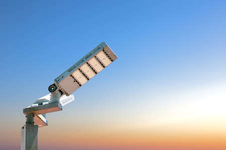 The electric pole is lit with LED bulbs using solar energy.