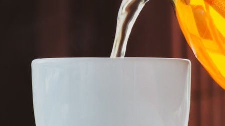 Pour hot tea into a healthy drink cup.の写真素材