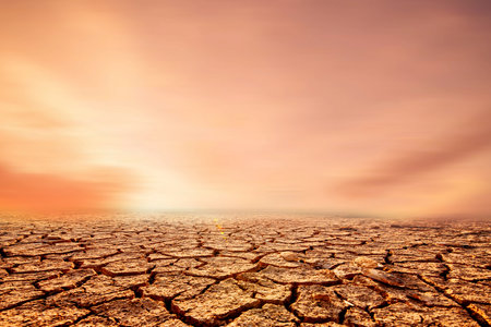 Earth that melts in arid soils cracks due to global warming. concept of environmental conservation and global warming reductionの写真素材