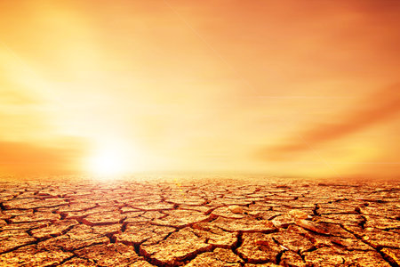 Earth that melts in arid soils cracks due to global warming. concept of environmental conservation and global warming reductionの写真素材