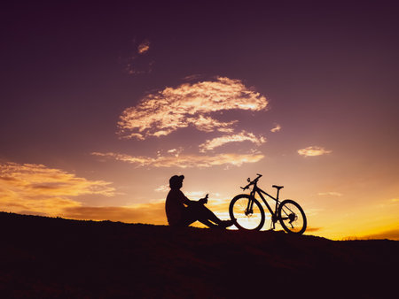 Man with a mountain bike on a beautiful day.の写真素材