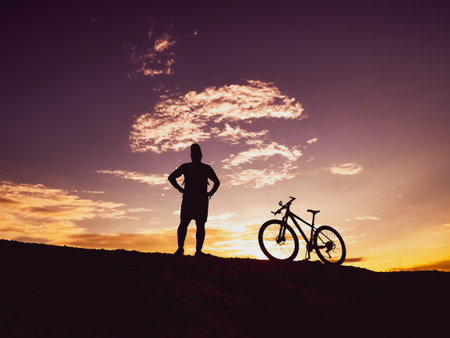 Man with a mountain bike on a beautiful day.の写真素材