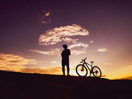 Man with a mountain bike on a beautiful day. happy men and bicyclesの写真素材
