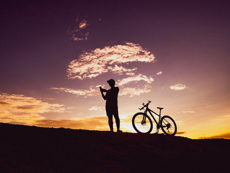 Man with a mountain bike on a beautiful day.の写真素材