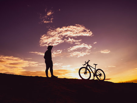 Man with a mountain bike on a beautiful day.の写真素材