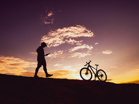 Man with a mountain bike on a beautiful day. happy men and bicyclesの写真素材