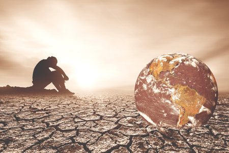 Concept of global warming and drought. People are sitting in despair because of the drought. a world without waterの写真素材