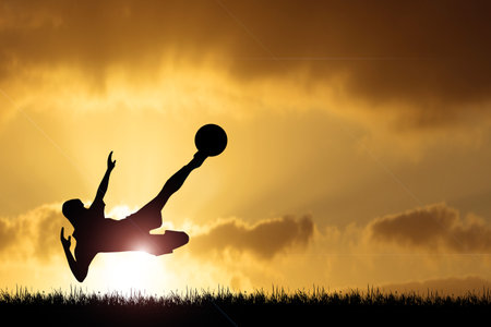 Silhouette of soccer players playing soccer in the evening. Fun concept of playing football.の写真素材