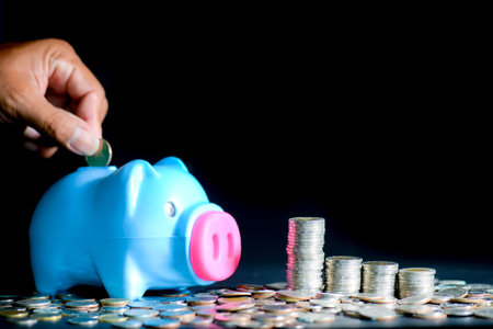 Piggy bank and lots of coins. money saving and money management conceptの写真素材