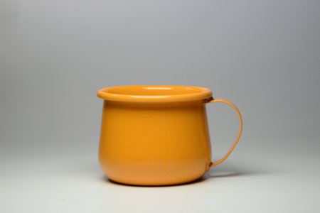 Zinc glass bright orange on a white background. Ideas for mock ups.

Blank mock up Empty classic undervest mug with neckline mockup, isolated.の写真素材