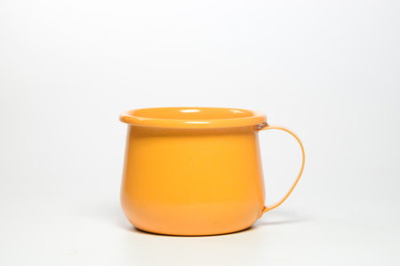 Zinc glass bright orange on a white background. Ideas for mock ups.

Blank mock up Empty classic undervest mug with neckline mockup, isolated.の写真素材