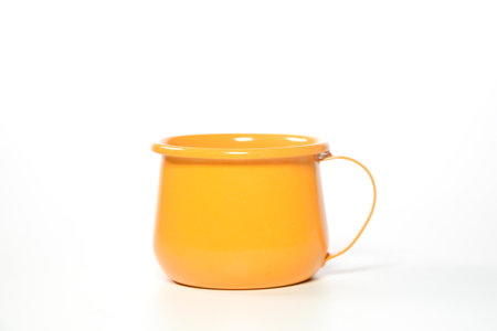 Zinc glass bright orange on a white background. Ideas for mock ups.

Blank mock up Empty classic undervest mug with neckline mockup, isolated.の写真素材