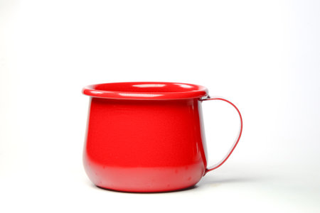 Bright red zinc mug on white background . Idea for a classic blank mockup undervest mockup.の写真素材