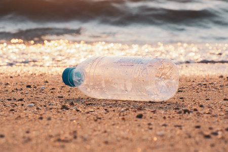Trash bottles at the beach. garbage and pollution conceptの写真素材