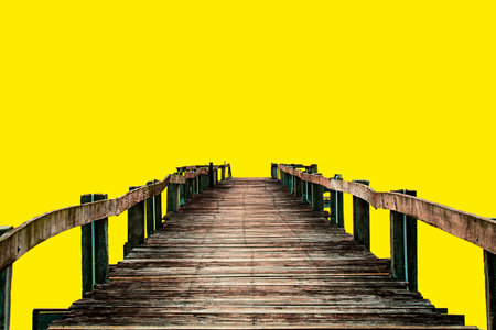 classic wooden bridge on colored background with clipping pathの写真素材