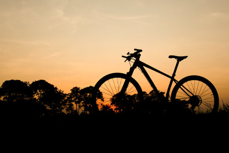Silhouette of a mountain bike in the evening. fitness and adventure ideasの写真素材