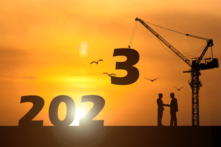 Happy New Year 2023 concept. Businessmen join hands. Successful in contacting workの写真素材