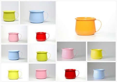 Collection of colorful enameled pots on white background. 3d renderingの写真素材
