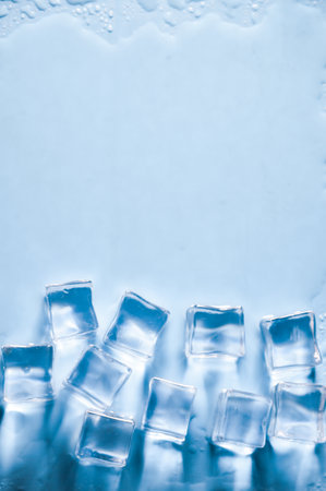 Ice cubes on studio blue background. The concept of freshness with coolness from ice cubes.の写真素材