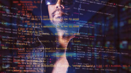 The concept of hackers and insecurity in networking. Dishonest hood man or data thieves
