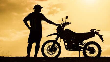 Tourists with motorcycles, motocross. Adventure tourists on motorcycles. men's holiday event ideasの写真素材