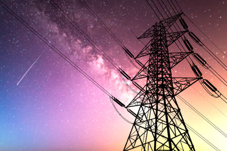 High voltage power lines and pylons at night sky background.の写真素材