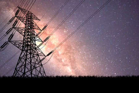 High voltage power line and milky way at night sky background.の写真素材