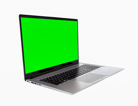 Laptop with green screen isolated on white background. 3d renderの写真素材