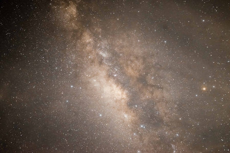 Captivating image of the Milky Way galaxy showcasing a dense cluster of stars and cosmic dust in the...