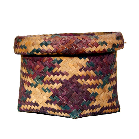 ** Vibrant woven basket isolated on a white background, perfect for product displays, design projects, and creative presentations.

**の写真素材
