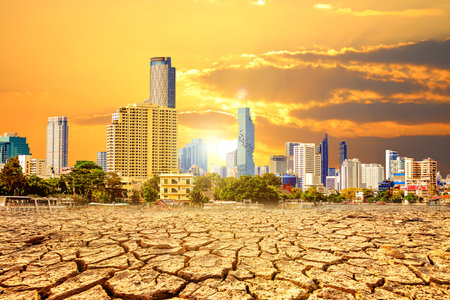 Dry land and cityscape at sunset, Global warming concept.の写真素材