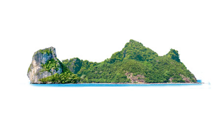 A breathtaking view of a lush tropical island with rocky cliffs, surrounded by clear blue ocean, isolated against a bright sky.の写真素材